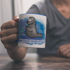 Kaffeebecher mit Seehund Motiv und Spruch: Ich will einen Seehund, der klatscht, ...