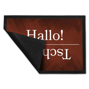 Hallo und Tschüss Fußmatte auf türkisfarbenem Hintergrund