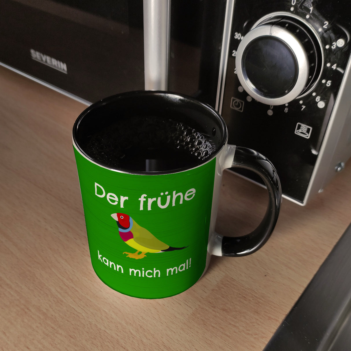 Kaffeebecher mit Bild und Spruch Der frühe Vogel kann mich mal!