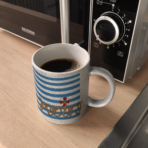 Kaffeebecher mit Moin-Schriftzug und Rettungsring