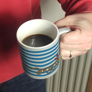 Kaffeebecher mit Moin-Schriftzug und Rettungsring