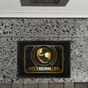 Weltenbummler Fußmatte mit goldenem Globus und Reisemotiv