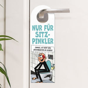 Bitte im Sitzen pinkeln Türhänger im Comic-Stil schwarz