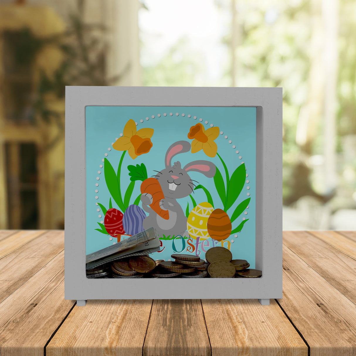 Frohe Ostern Spardose mit niedlichem Osterhasen und Ostereiern
