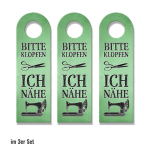 Bitte klopfen ich nähe Türhänger mit Nähmaschine