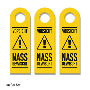 Vorsicht Nass gewischt Türhänger mit Hintergrund