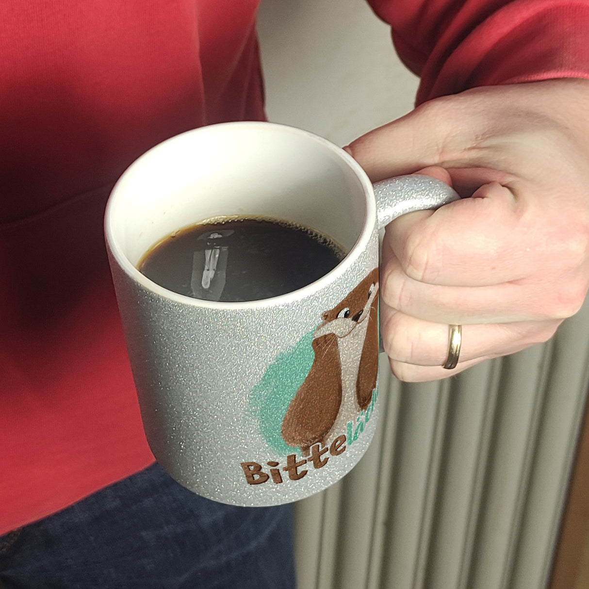 Lachender Otter Kaffeebecher mit Spruch Bitte lächeln