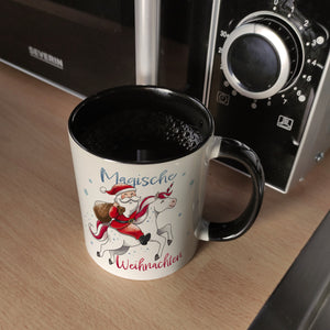 Weihnachtsmann auf Einhorn Kaffeebecher mit Spruch Magische Weihnachten