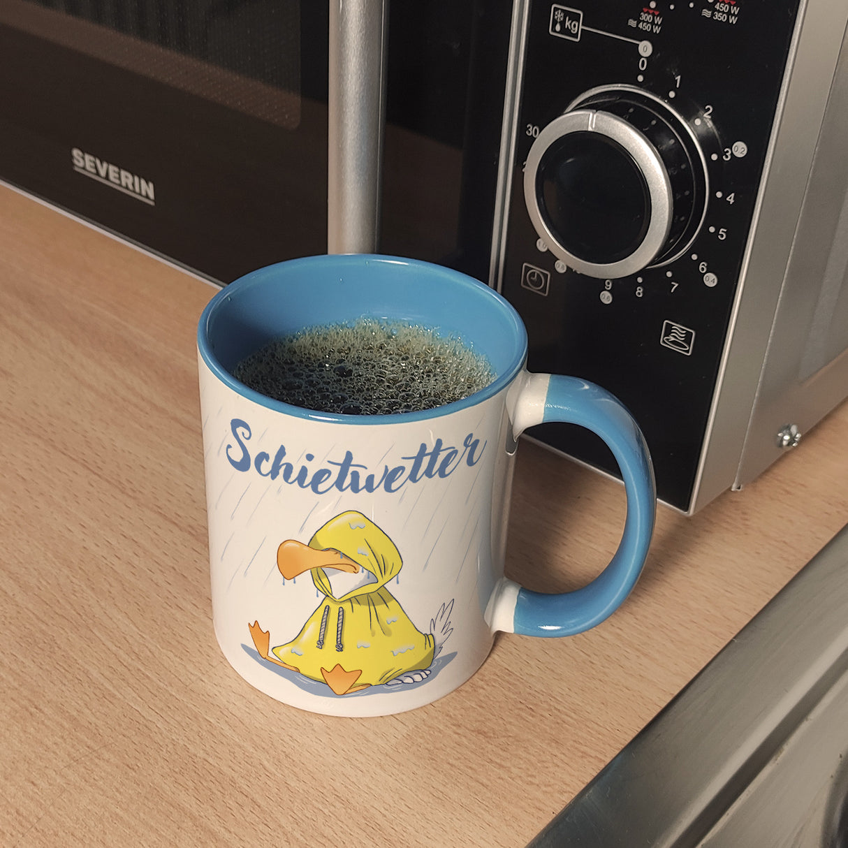 Möwe Kaffeebecher mit Spruch Schietwetter