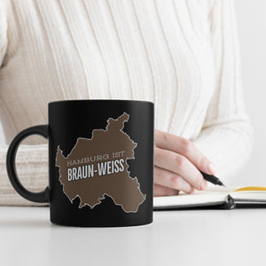 St. Pauli Tasse in Schwarz mit Spruch Hamburg ist braun-weiss