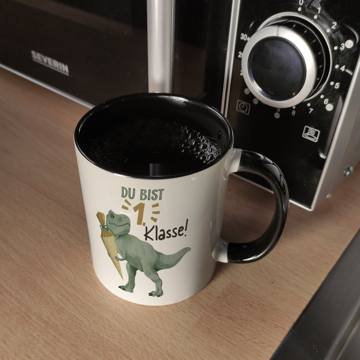 Dino mit Schultüte Kaffeebecher mit Spruch Du bist 1. Klasse!