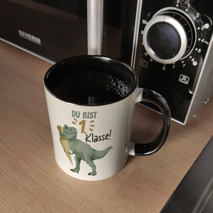Dino mit Schultüte Kaffeebecher mit Spruch Du bist 1. Klasse!