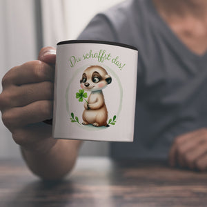Erdmännchen mit Kleeblatt Kaffeebecher mit Spruch Du schaffst das