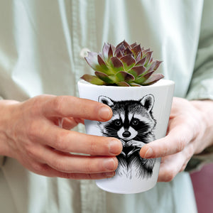 Waschbär zeigt Herz Blumentopf für Tierliebhaber