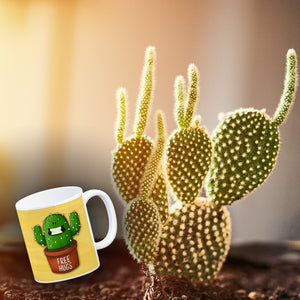 Kaffeebecher mit freundlicher Kaktus Motiv und Spruch: Free Hugs