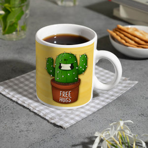 Kaffeebecher mit freundlicher Kaktus Motiv und Spruch: Free Hugs
