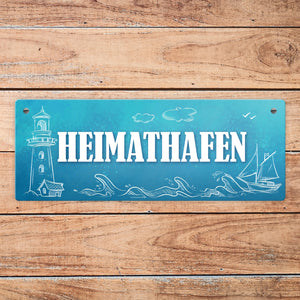 Metallschild mit maritimen Motiv und Spruch: Heimathafen