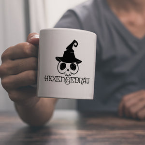 Kaffeebecher mit lustigem Halloween Motiv - Totenkopf mit Hexenhut