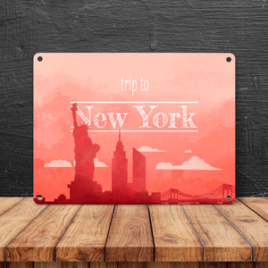 Metallschild in 15x20 cm für Fans von Städtetrips mit der Silhouette von New York in orange