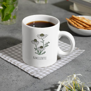 Kamillentee Teetasse mit Kamillenblüte für Teetrinker
