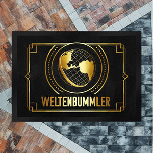 Weltenbummler Fußmatte mit goldenem Globus und Reisemotiv