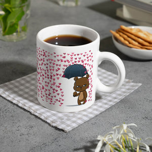 Grummeliges Bärchen im Herz-Regen Kaffeebecher