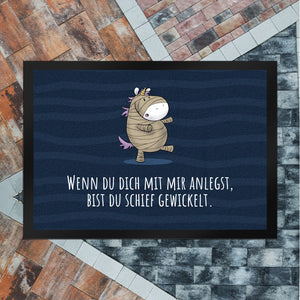 Einhorn-Mumie Fußmatte in 35x50 cm mit Spruch Du bist schief gewickelt