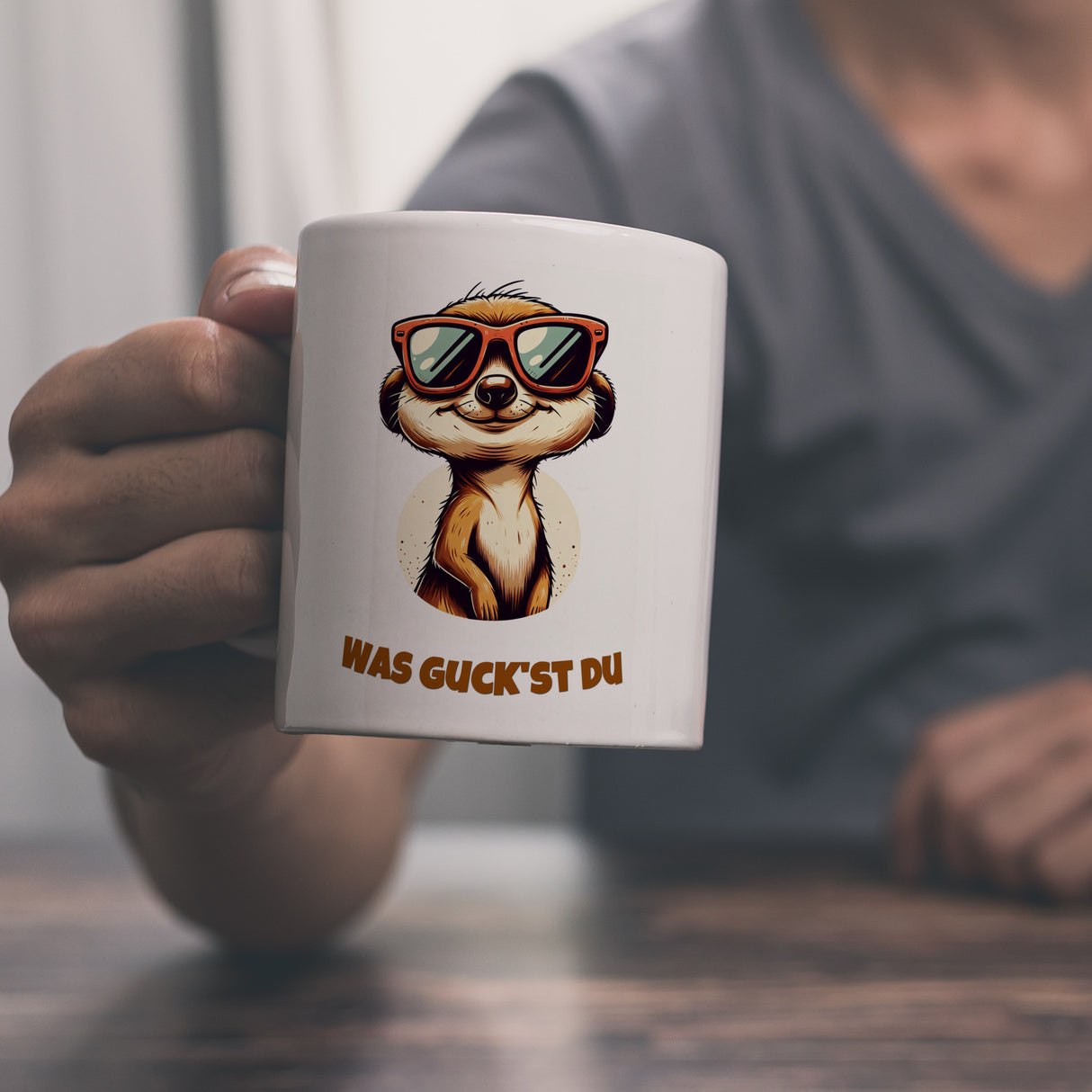 Erdmännchen Geschenke Kaffeebecher mit Spruch Was guckst du